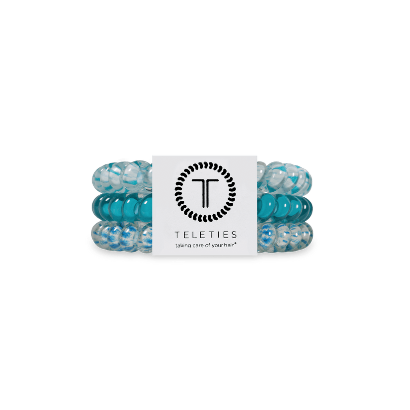 Set of Soft Surf hair ties with a Teleties branded card on a white background. Available at Be Charmed