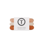Stack of For the love of nudes hair ties with a Teleties branded card on a white background. Available at Be Charmed