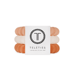 Large Stack of For the love of nudes hair ties with a Teleties branded card on a white background. Available at Be Charmed