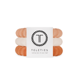 Large Stack of For the love of nudes hair ties with a Teleties branded card on a white background. Available at Be Charmed