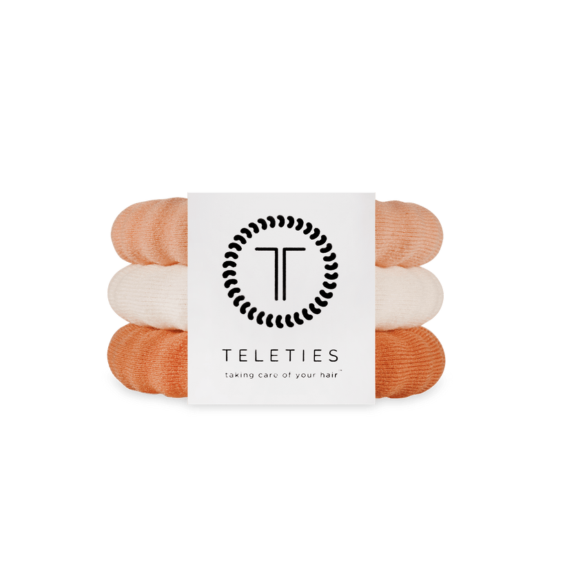 Large Stack of For the love of nudes hair ties with a Teleties branded card on a white background. Available at Be Charmed