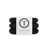 Large Set of jet black hair ties with a Teleties branded card on a white background. Available at Be Charmed