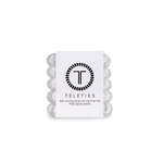 A pack of TIny Coonut White Teleties hair ties with a strong grip, presented in a clear package with a white label featuring the brand's logo.