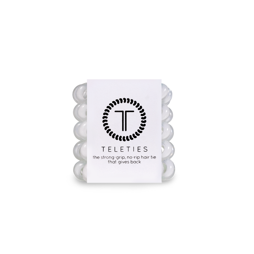 A pack of TIny Coonut White Teleties hair ties with a strong grip, presented in a clear package with a white label featuring the brand's logo.