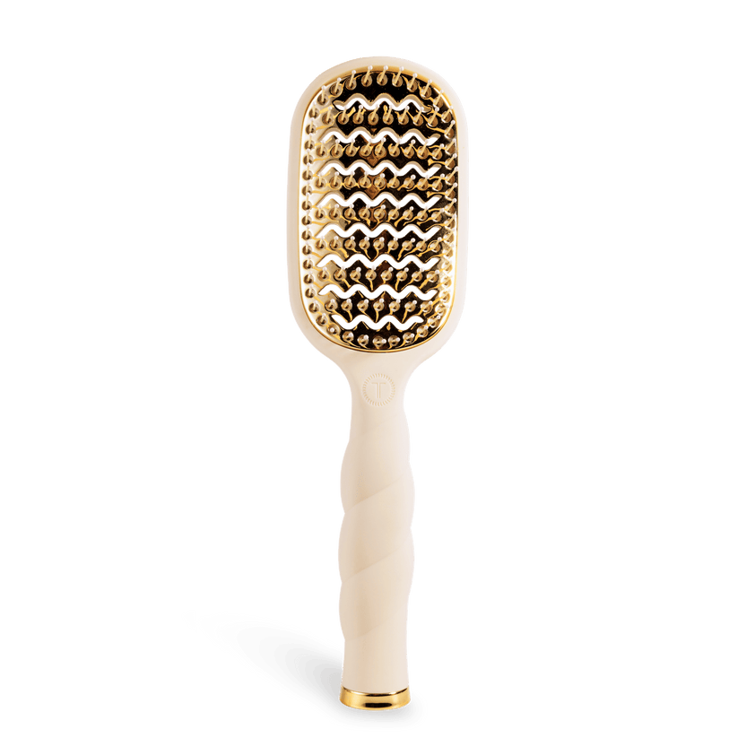 Tan Vented Teleties Hairbrush with gold bristle head and white handle on a transparent background. Available at Be Charmed