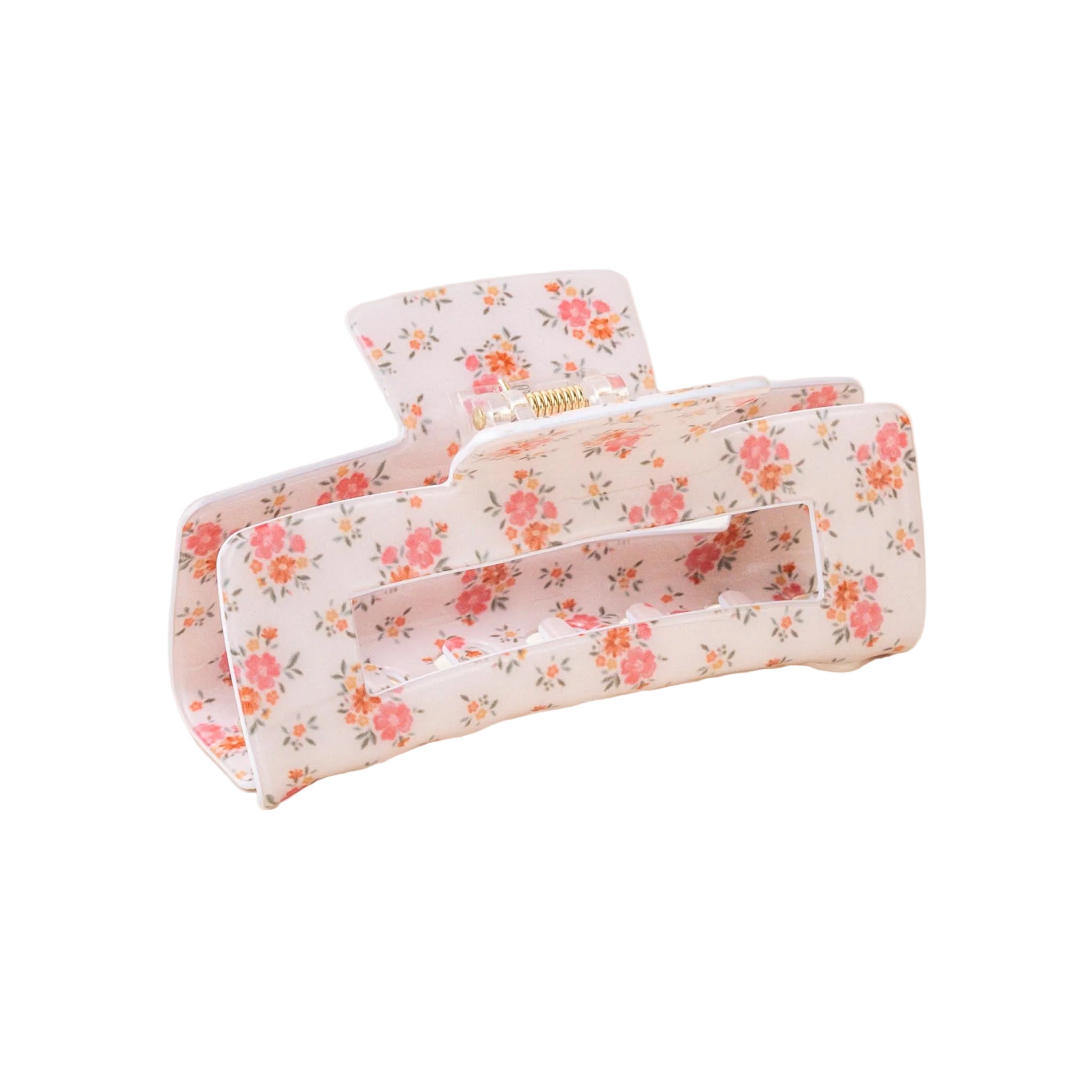A floral patterned hair claw clip on a light background. Available at Be Charmed