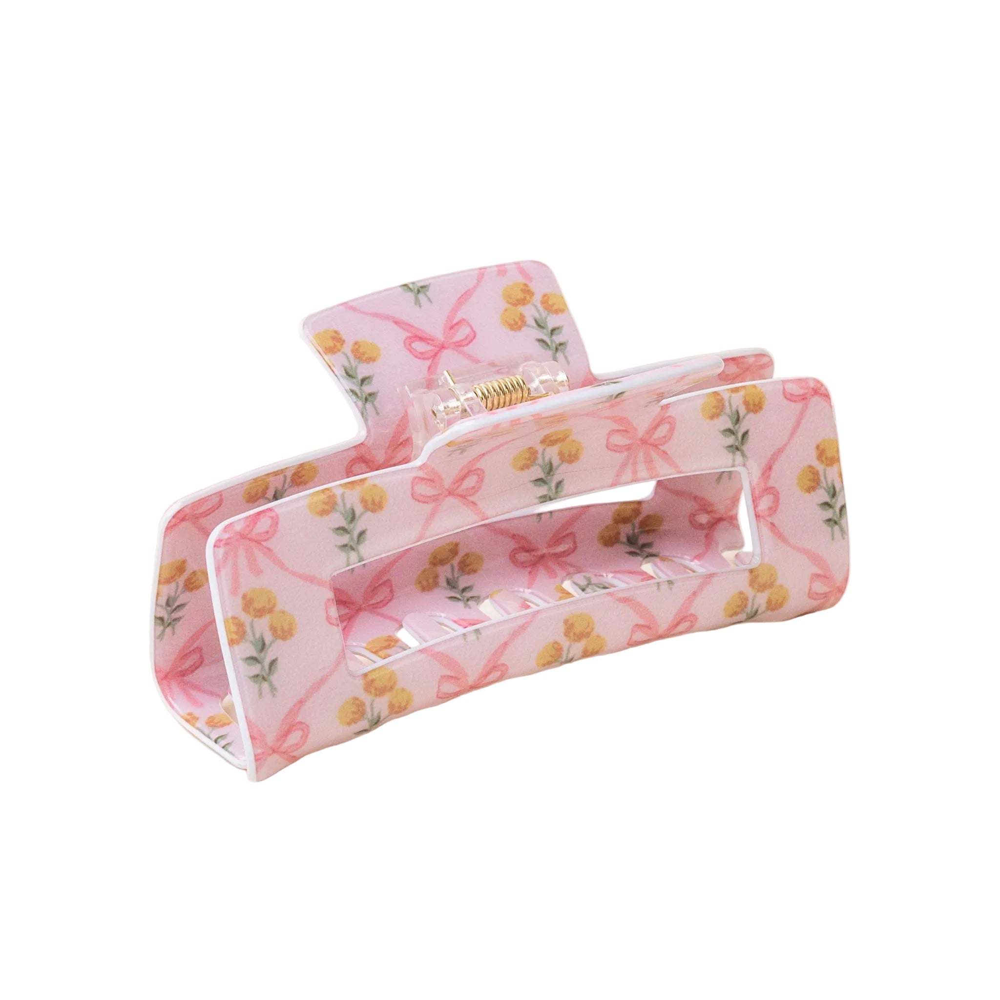 A floral patterned hair claw clip on a light background. Available at Be Charmed
