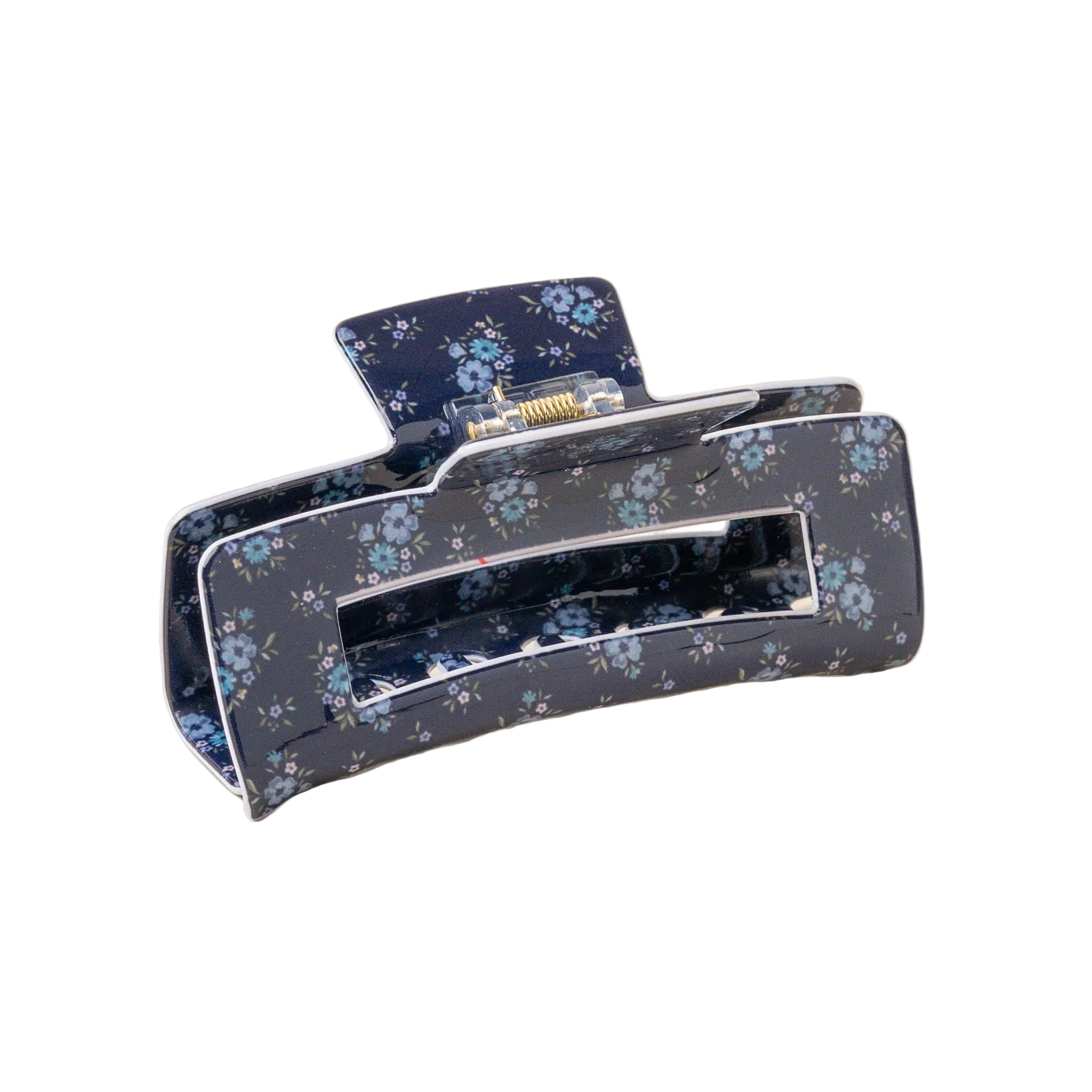 A floral patterned hair claw clip on a light background. Available at Be Charmed