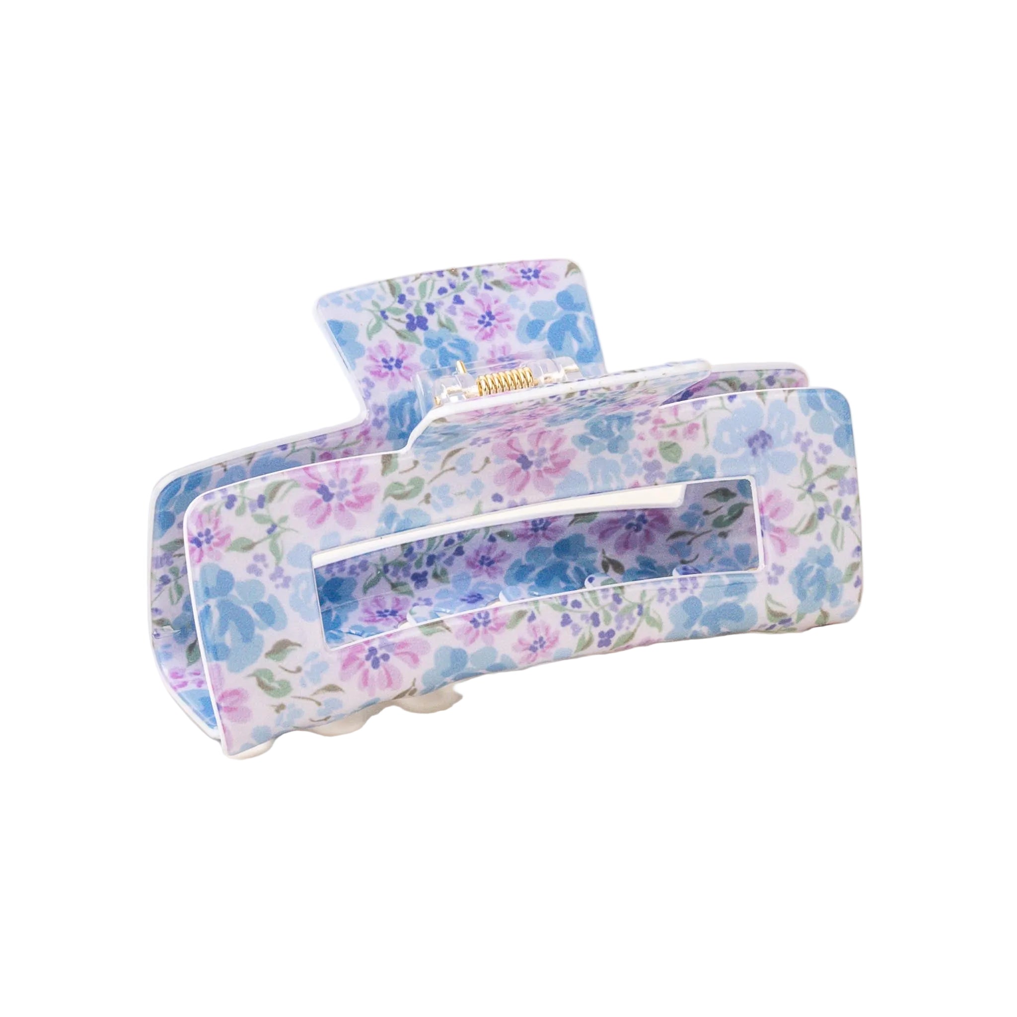 A floral patterned hair claw clip on a light background. Available at Be Charmed