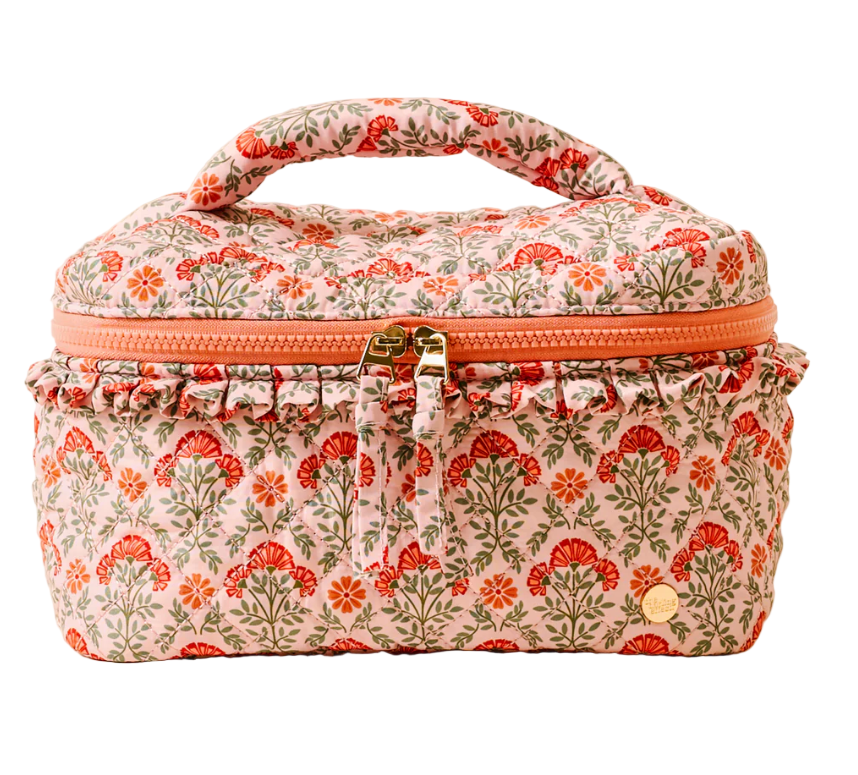 Floral-patterned makeup bag with a zipper on a white background. Available at Be Charmed