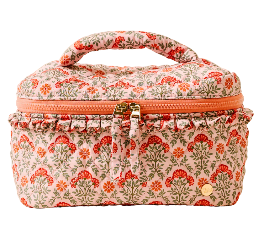 Floral-patterned makeup bag with a zipper on a white background. Available at Be Charmed