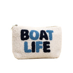 Pouch with 'BOAT LIFE' text on a beige background. Available at Be Charmed