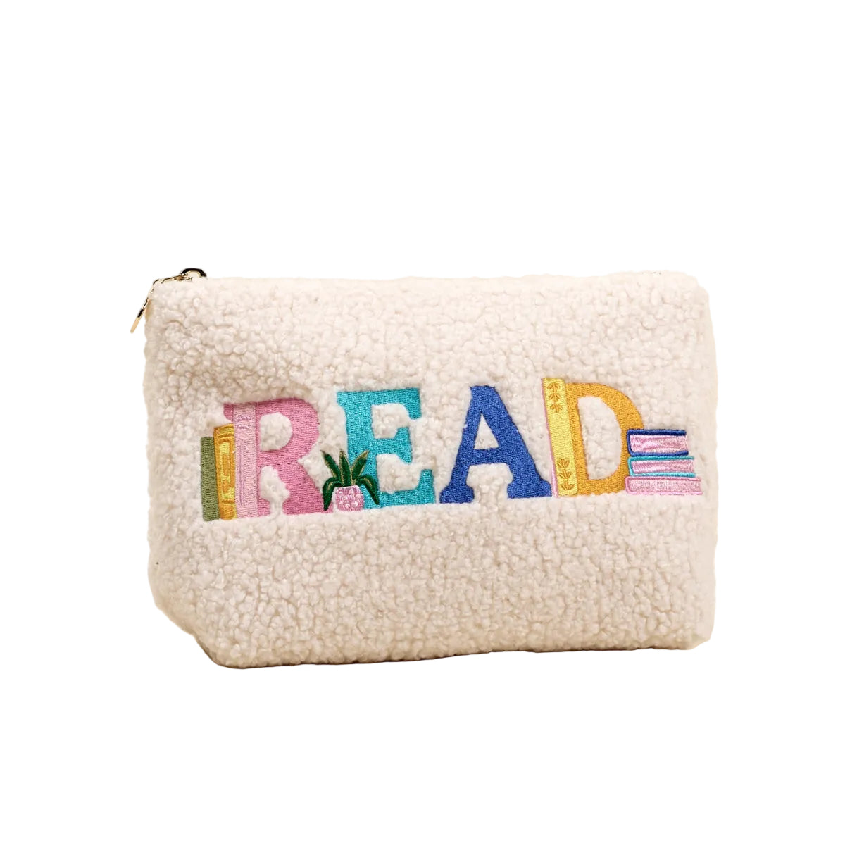 White fleece pouch with colorful 'READ' text on a beige background. Availablea at Be Charmed