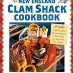 Book cover of 'The New England Clam Shack Cookbook' with a lobster and clams on a table. Available at Be Charmed