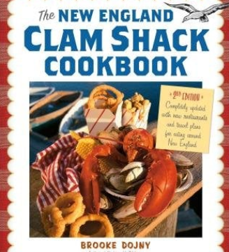 Book cover of 'The New England Clam Shack Cookbook' with a lobster and clams on a table. Available at Be Charmed