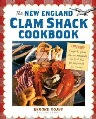 Book cover of 'The New England Clam Shack Cookbook' with a lobster and clams on a table. Available at Be Charmed
