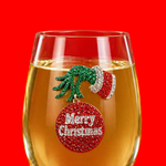 A premium handcrafted stemless wine glass featuring a sparkling jeweled rhinestone grumpy Christmas holiday design, available at Be Charmed.