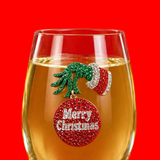 A premium handcrafted stemless wine glass featuring a sparkling jeweled rhinestone grumpy Christmas holiday design, available at Be Charmed.