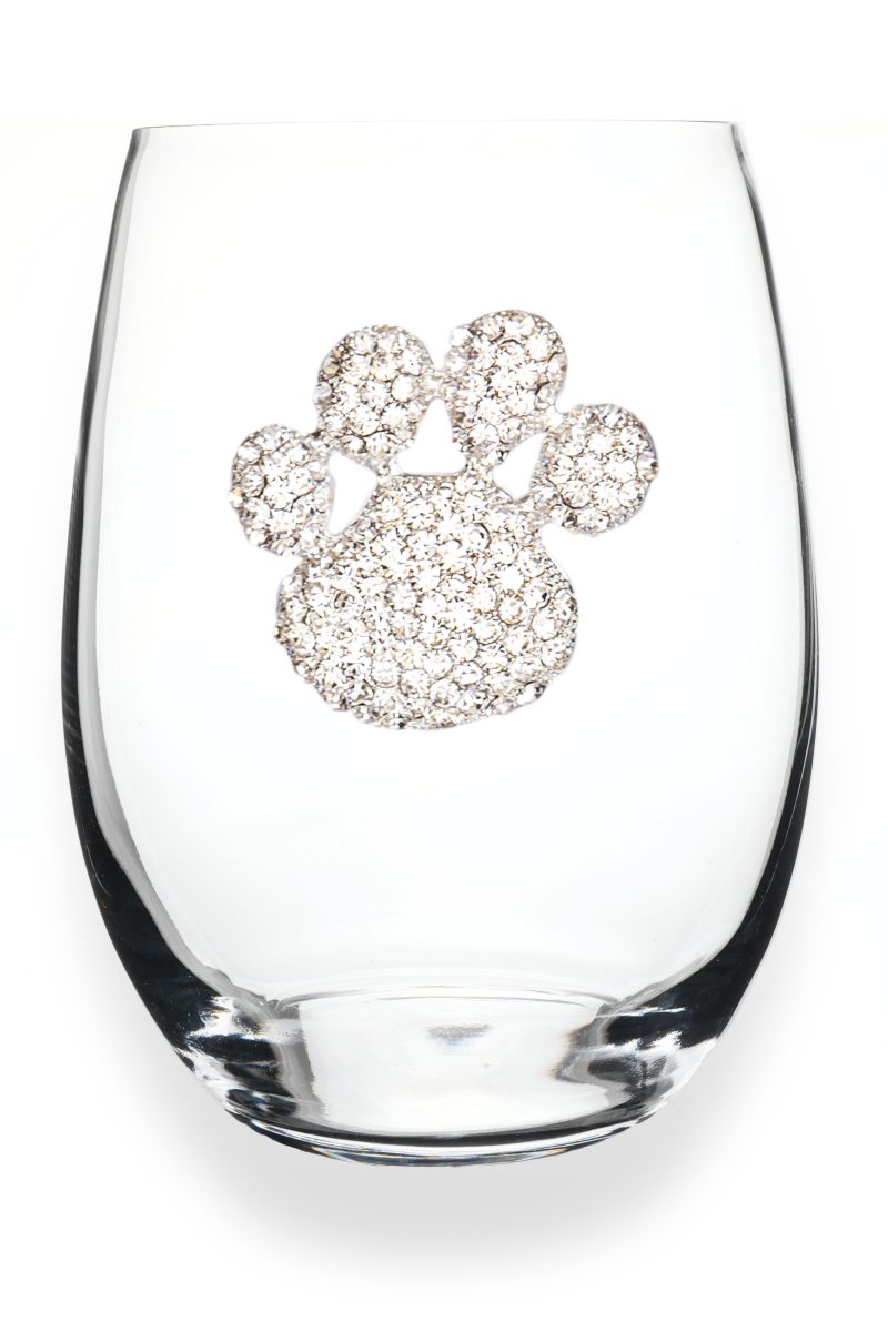A premium handcrafted stemless wine glass featuring a sparkling jeweled rhinestone paw print design, available at Be Charmed.