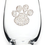 A premium handcrafted stemless wine glass featuring a sparkling jeweled rhinestone paw print design, available at Be Charmed.