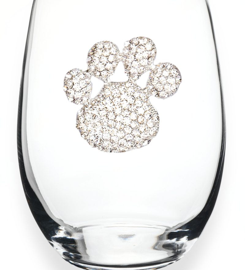 A premium handcrafted stemless wine glass featuring a sparkling jeweled rhinestone paw print design, available at Be Charmed.