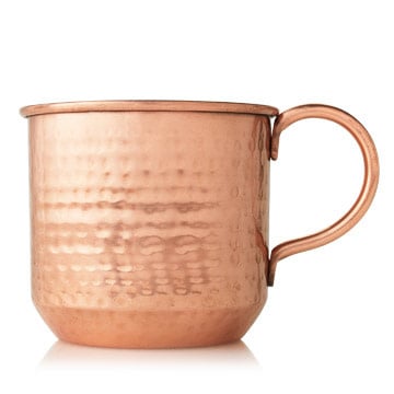 Thymes Simmered Cider 10 oz copper cup candle with hammered texture, warm apple, clove & cardamom scent—Available at Be Charmed.