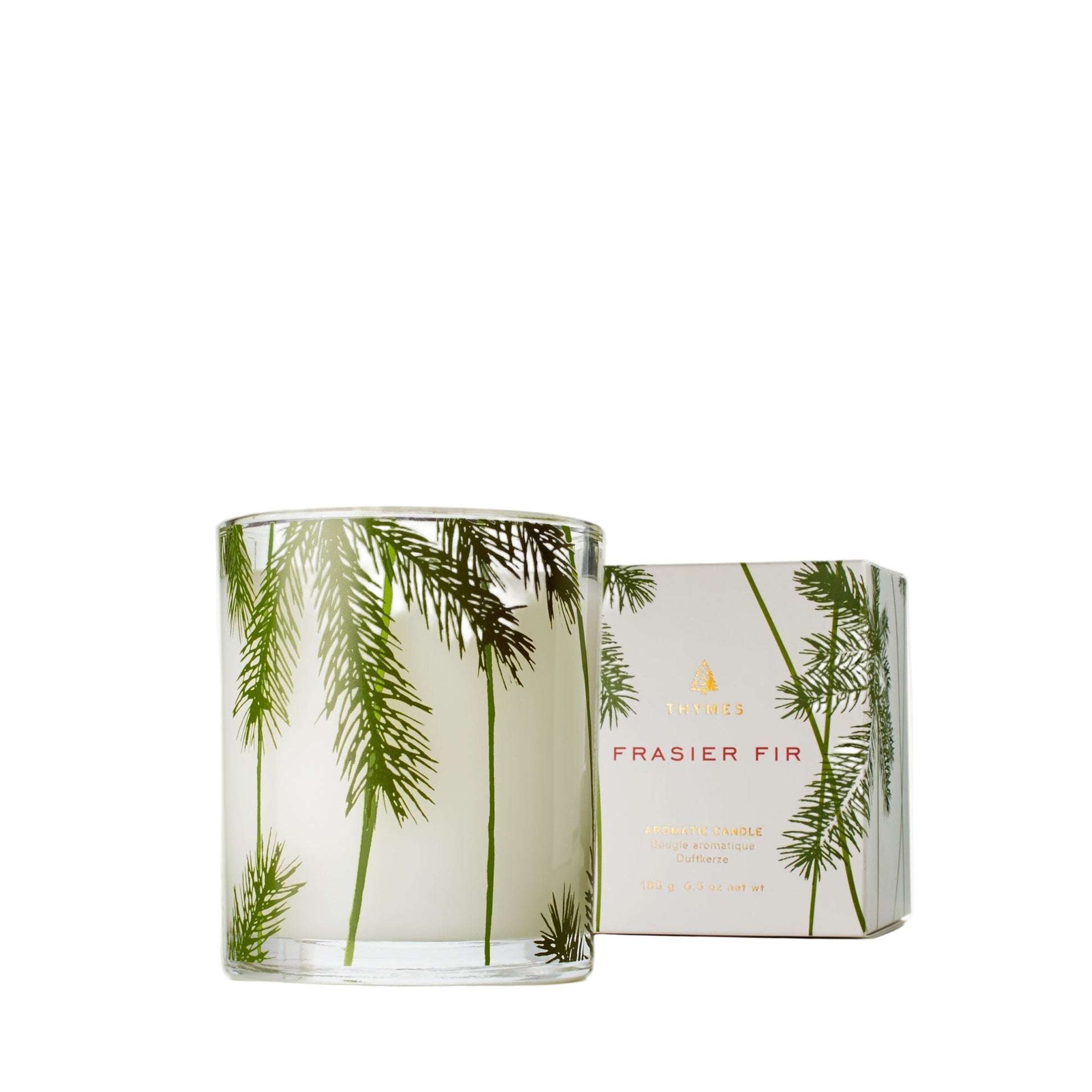 Fragranced candle with frasier fir design and packaging on a white background. Available at Be Charmed