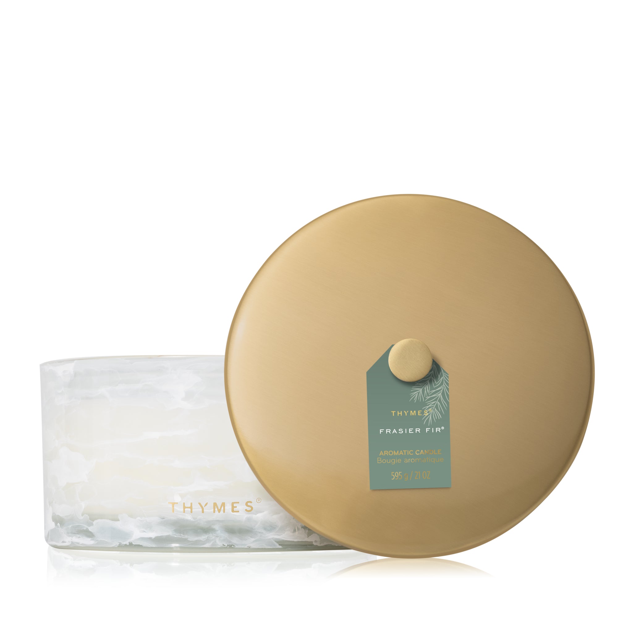 Thymes candle and container on a white background. Available at Be Charmed