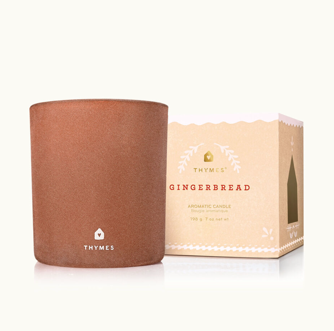 Thymes Gingerbread 7 oz Candle with warm, sweet holiday fragrance in a hand-poured design. Available at Be Charmed.
