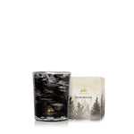 Thymes candle with forest-themed designs on a white background. Available at Be Charmed.  