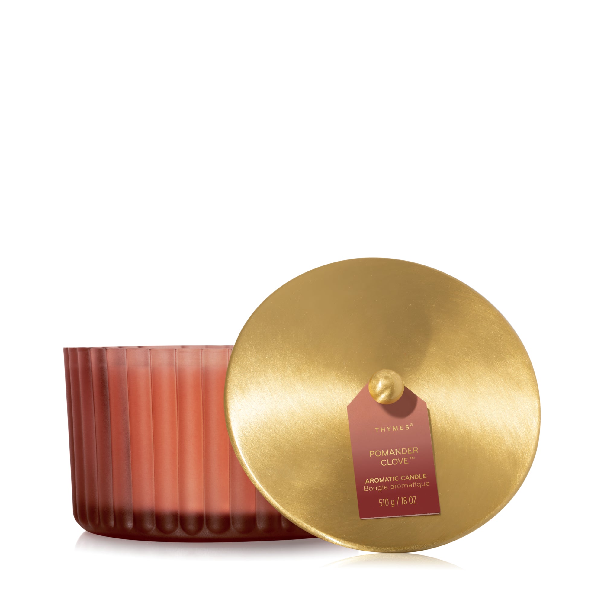 Thymes Candle with a gold lid on a white background. Available at Be Charmed
