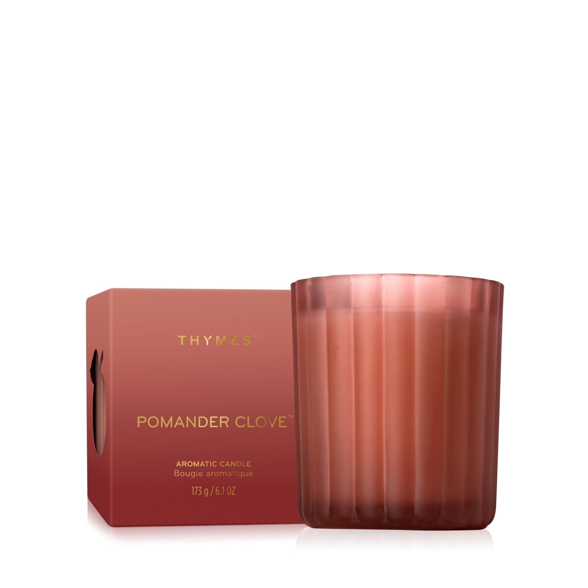 Thymes pomander clove candle with packaging on a white background. Available at Be Charmed