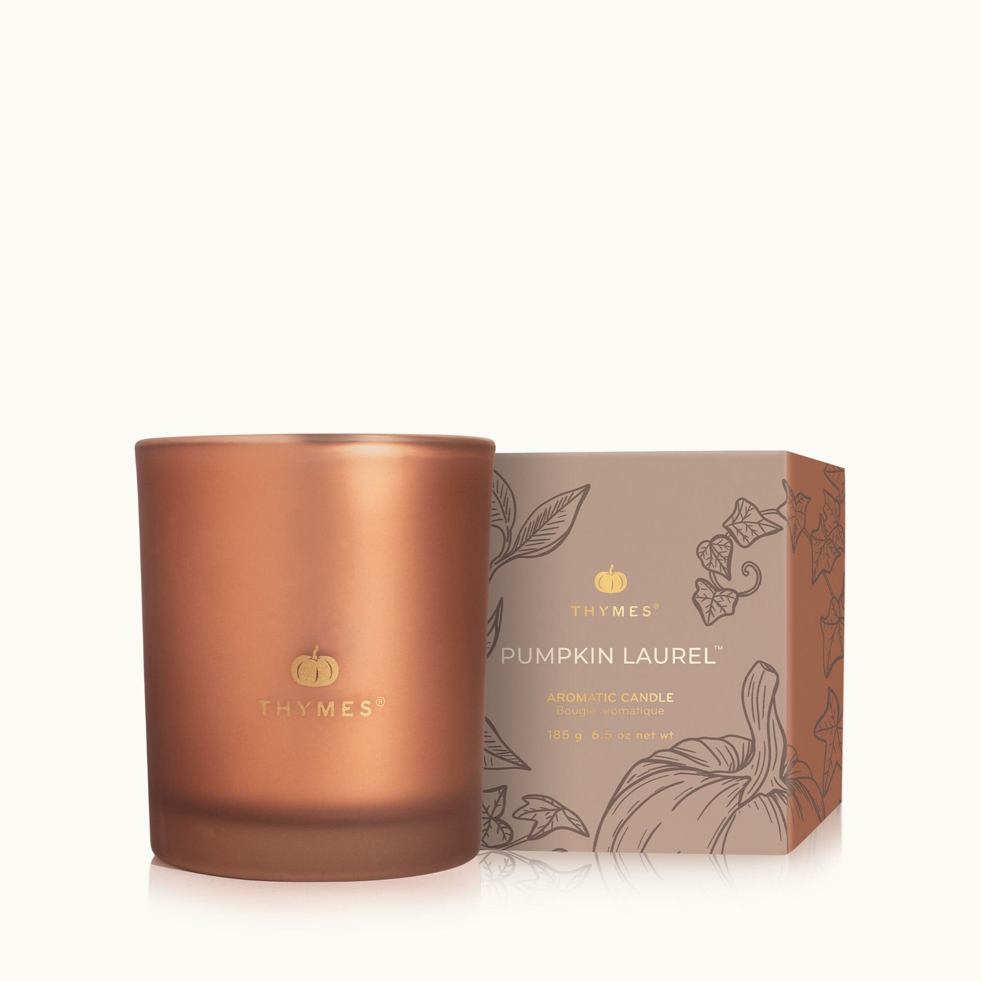 Thymes Pumpkin Laurel 6.5 oz boxed candle in burnt-orange candle tin with gold lid—Available at Be Charmed.