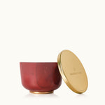 Thymes Simmered Cider Candle Tin with Gold Lid, warm spiced fragrance in a festive container. Available at Be Charmed.