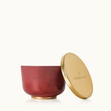 Thymes Simmered Cider Candle Tin with Gold Lid, warm spiced fragrance in a festive container. Available at Be Charmed.