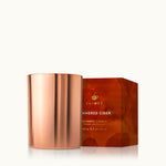 Thymes Simmered Cider 6.5 oz poured tin candle in rose-gold tin with apple, clove & cardamom scent—Available at Be Charmed.