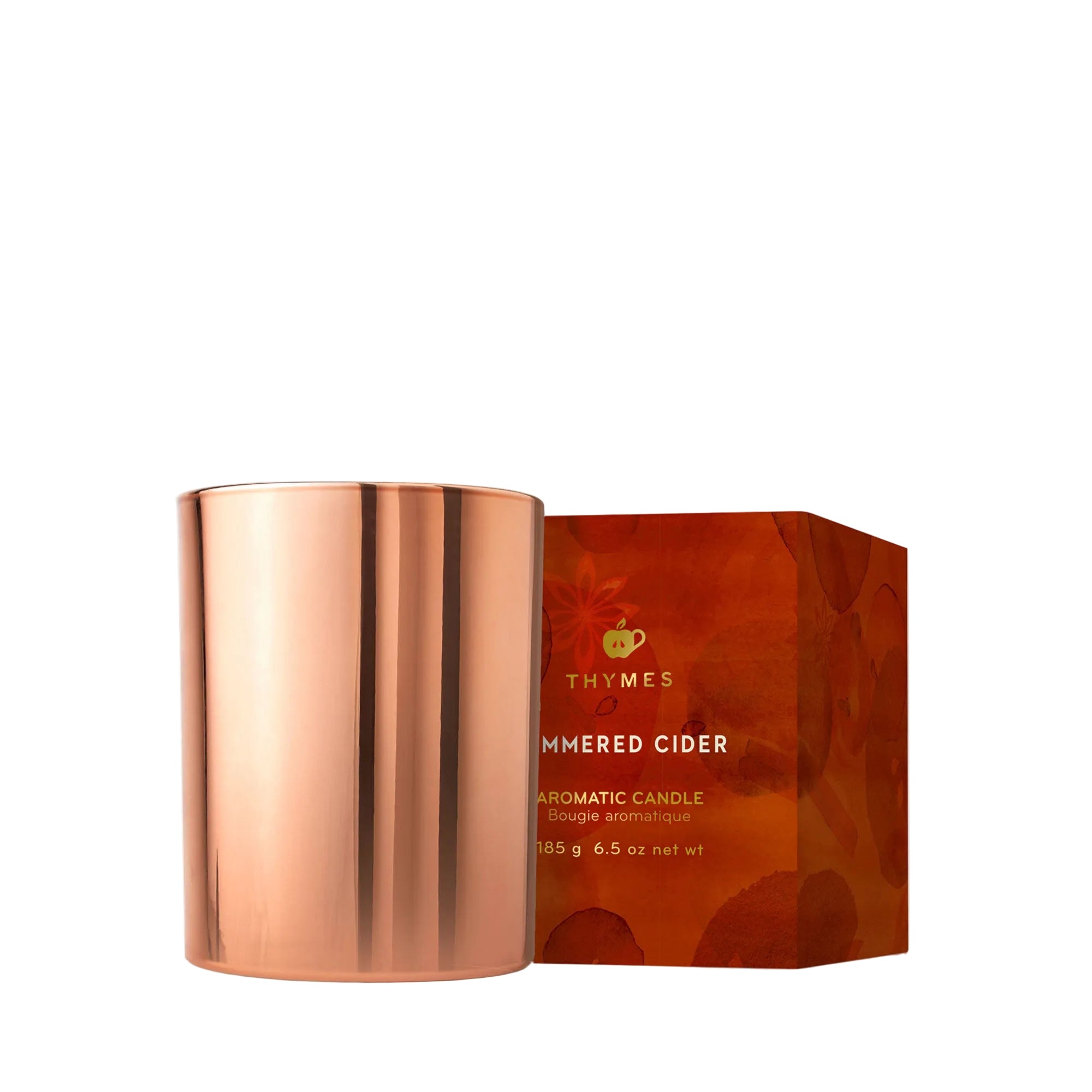 Thymes Simmered Cider 6.5 oz poured tin candle in rose-gold tin with apple, clove & cardamom scent—Available at Be Charmed.
