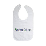 A white cotton bib with velcro closure, featuring the text 'MEDFIELD' and some decorative elements in blue and green. Available at Be Charmed