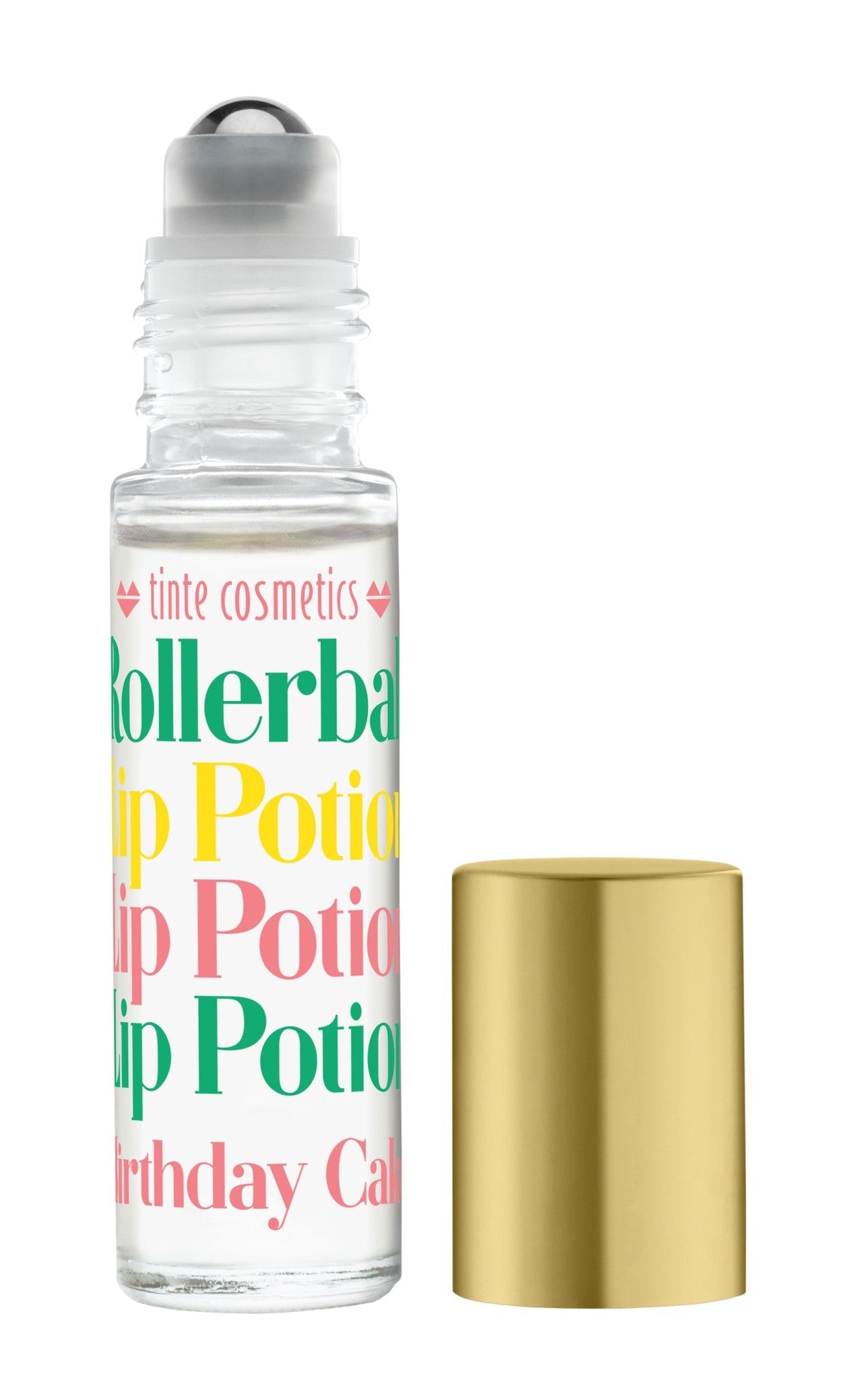 A clear rollerball lip potion bottle labeled 'Birthday Cake' with a colorful label, alongside a gold-colored lid. Available at Be Charmed