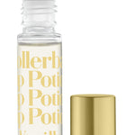 A clear rollerball lip potion bottle with 'TINTE COSMETICS' and 'KISSING POTION VANILLA' printed on it, alongside a gold-colored cap. Available at Be Charmed