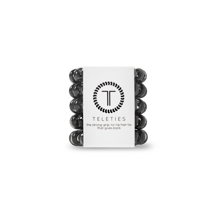 A pack of TIny Teleties hair ties in Jet Black, presented in a white box with the Teleties logo. Available at Be Charmed