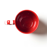 Red mug on a white background. Available at Be Charmed