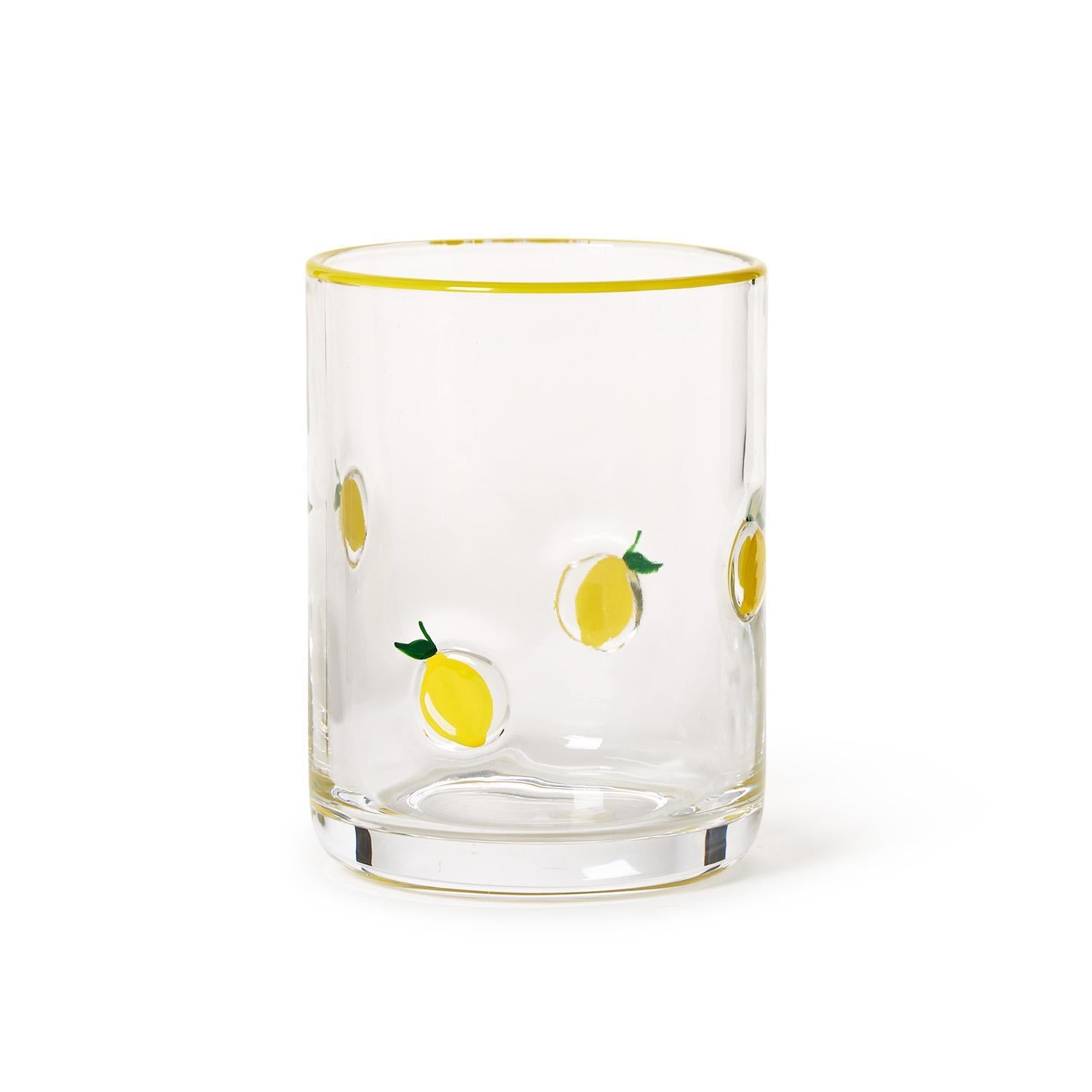 Clear glass double old fashioned with yellow lemon illustrations on a white background. Available at Be Charmed