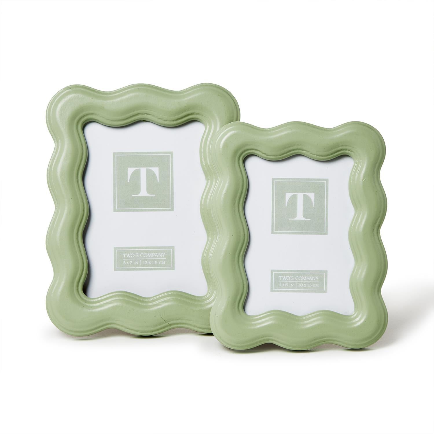 Two green picture frames with a decorative border on a white background.  Available at Be Charmed