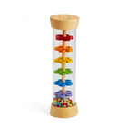 Colorful rattle toy with wooden base and lid on a white background. Available at Be Charmed