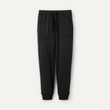 A pair of black UGG men's jogger pants with a drawstring waist and a brand tag on the lower left side. Available at Be Charmed