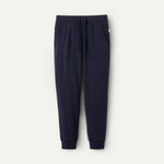 A pair of navy blue UGG men's jogger pants with a drawstring waist and a brand tag on the lower left side. Available at Be Charmed