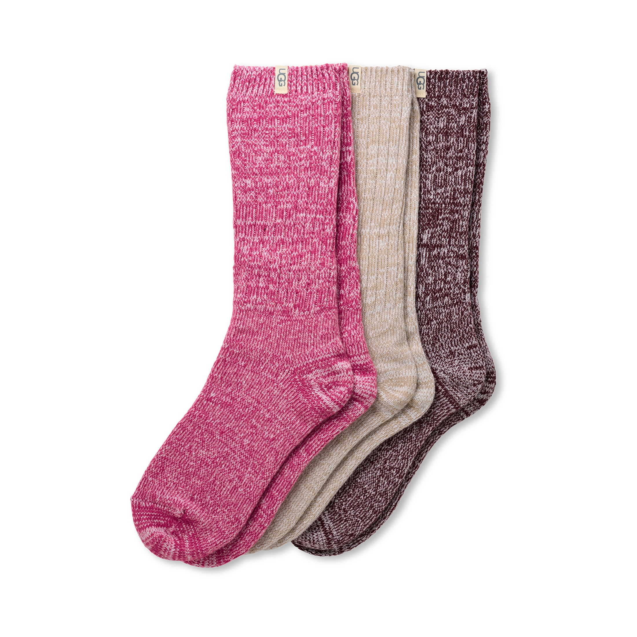 Three pairs of UGG rib knit slouchy socks in pink, beige, and brown on a white background. Available at Be Charmed.