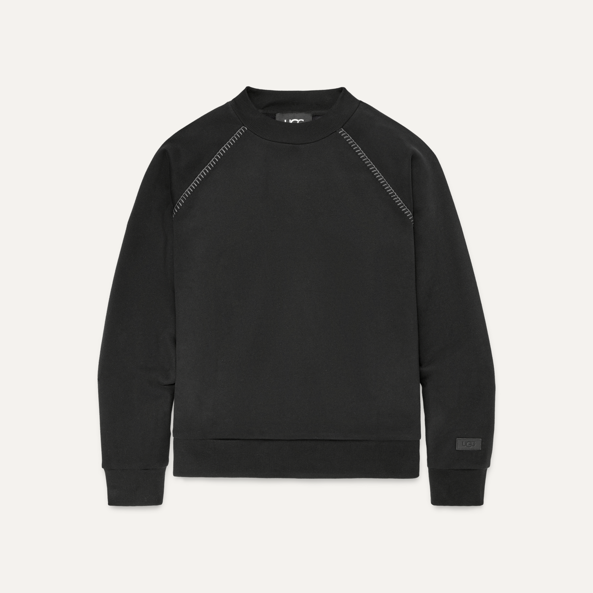 A black crewneck sweatshirt with twin seam details and an overlapping neckline. Available at Be Charmed