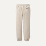 Beige sweatpants with a pocket on a white background. Available at Be Charmed. 